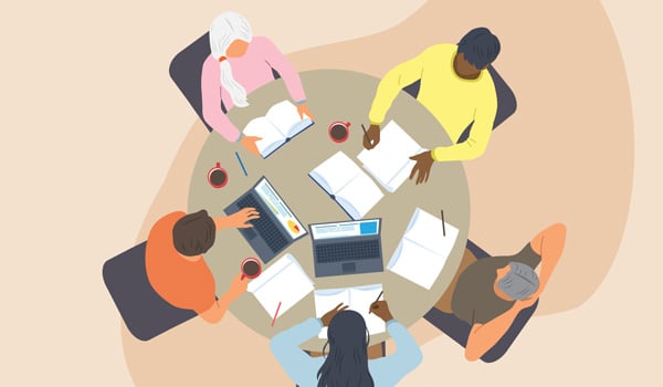 Overhead view of people working at a round table